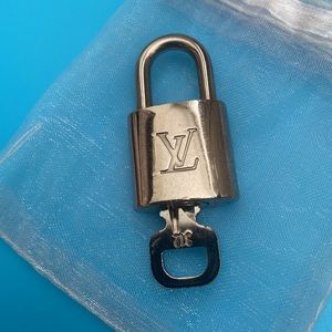 # 312 Authentic LV Silver Lock and Key